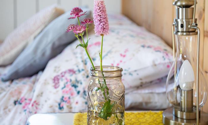 Bed and fresh flowers